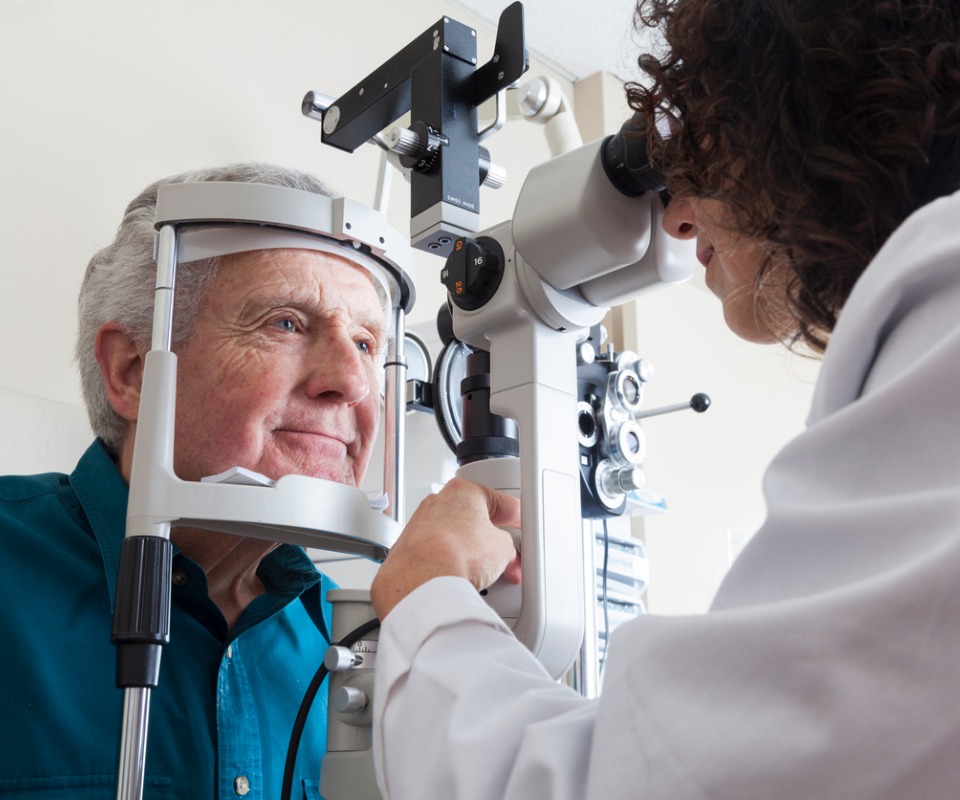 optometrist with senior patient picture